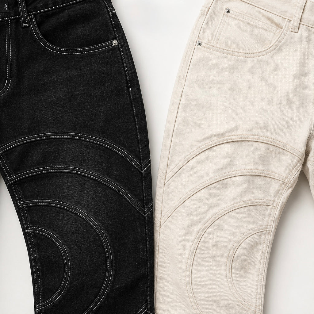 Close-up of the Voyager denim pants construction and contrast topstitching in Midnight and Limestone, both showing curved seam detailing and pocket construction.