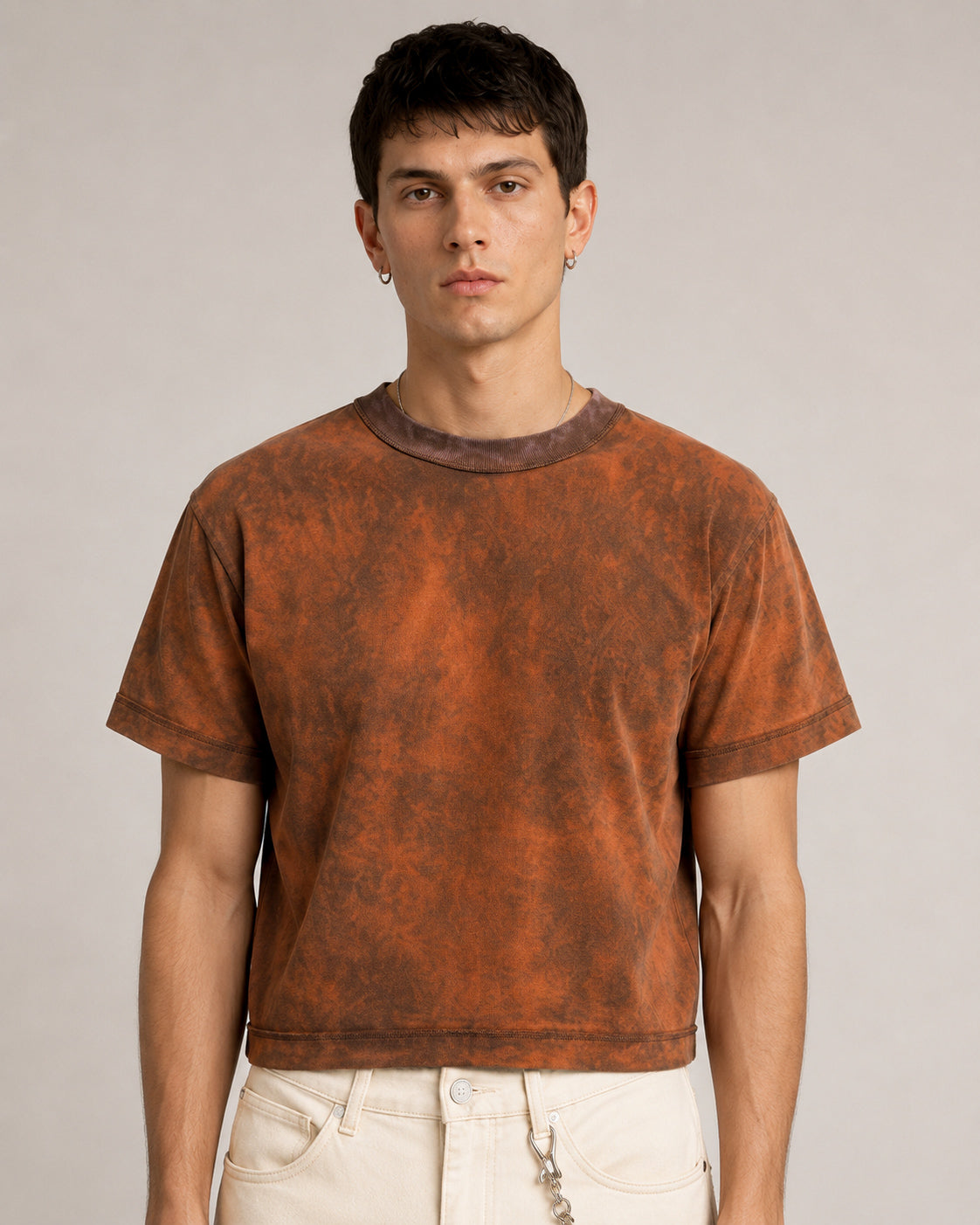 Close up view of Model wearing the brown Sunfaded Reversible T-Shirt, front view, showing its boxy cropped fit.