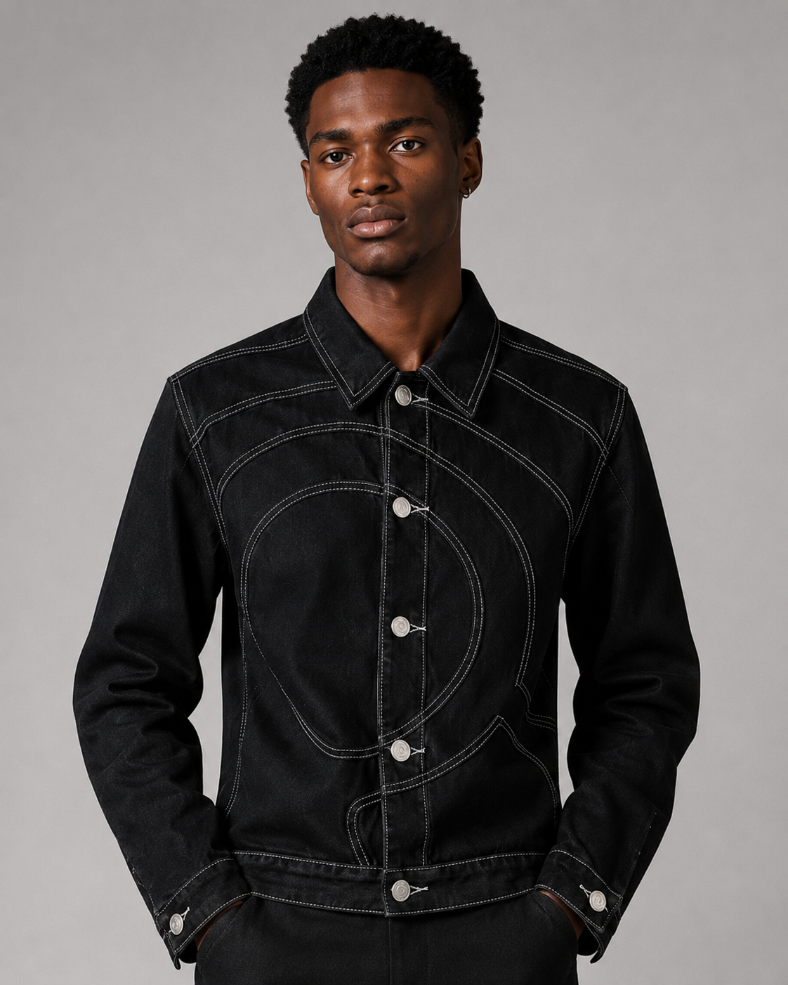 Model wearing the Midnight Voyager Denim Jacket, front view, showing the slim cropped fit and curved light grey topstitching.