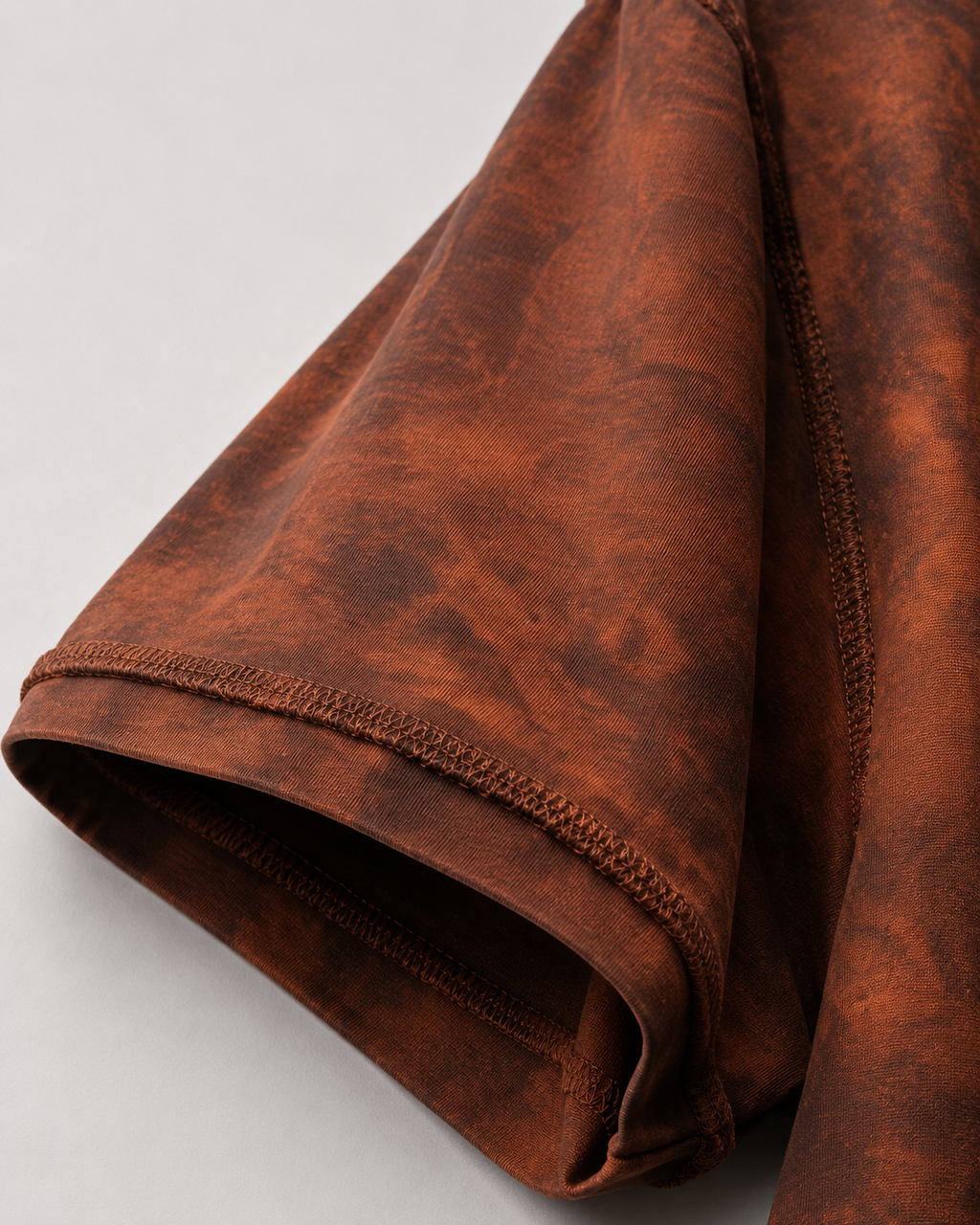 Close-up of the  sleeve raw-edge detailing on the Sunfaded Reversible T-Shirt.