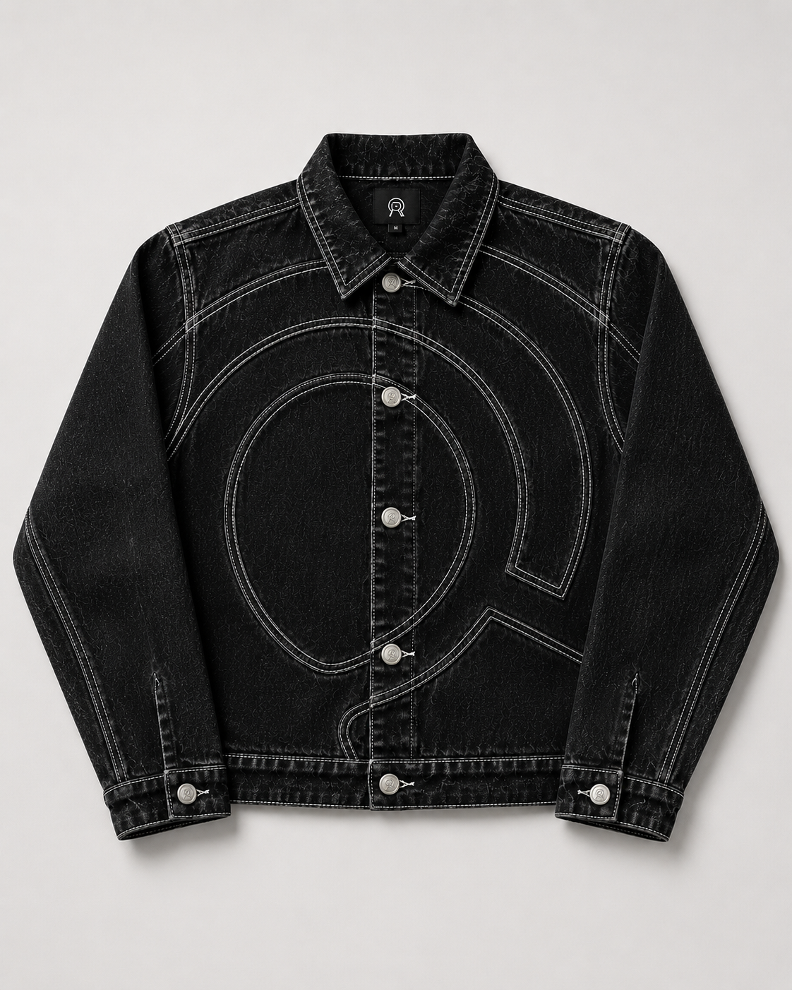 Midnight Voyager Denim Jacket, front view, with curved light grey double-needle topstitching and gunmetal R-logo buttons.