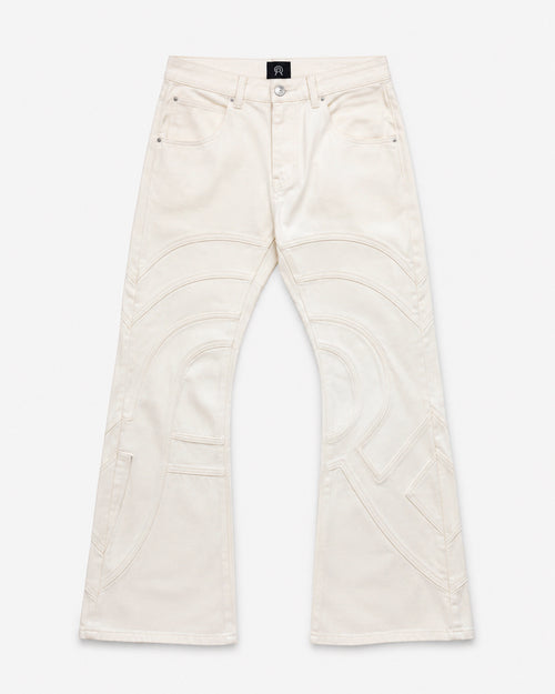 Voyager Denim Pant in Limestone, front view, showing the slim flared silhouette and curved contrast topstitching.