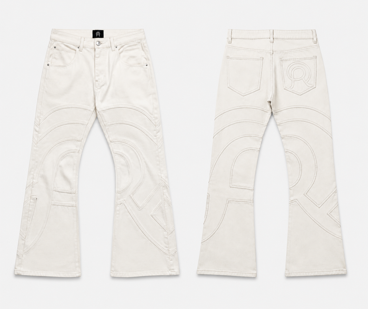 Voyager Denim Pant in Limestone, front and back view, showing the slim flared silhouette and curved contrast topstitching.